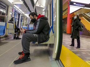 Métro riders wear masks in Montreal Wednesday, January 27, 2021.