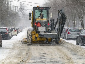 A plow clears snow on Barclay Ave. in Montreal Feb. 2, 2021.