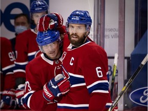 Canadiens captain Shea Weber, who played his 1,000th NHL game Tuesday night, congratulates Tyler Toffoli for the second of two goals he scored in the game.