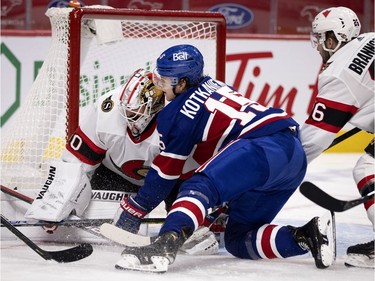 Montreal Canadiens centre Jesperi Kotkaniemi (15) collides with Ottawa Senators goaltender Matt Murray (30) after being hit by Ottawa Senators Erik Brannstrom, right, at the Bell Centre Thursday, Feb. 4, 2021.