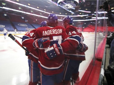 Teammates congratulate Josh Anderson after his first period goal against the Toronto Maple Leafs at the Bell Centre on Wednesday, Feb. 10, 2021.