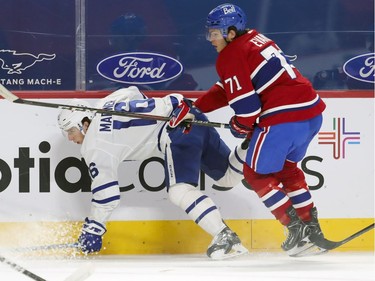 Jake Evans knocks down Toronto Maple Leafs' Mitch Marner during second period at the Bell Centre on Wednesday, Feb. 10, 2021.
