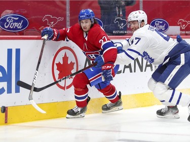 Alexander Romanov and Toronto Maple Leafs' Pierre Engvall chase loose puck during second period at the Bell Centre on Wednesday, Feb. 10, 2021.