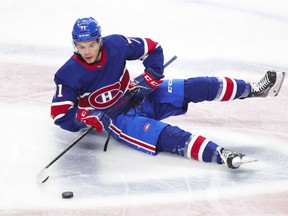 Canadiens centre Jake Allen tries to make a pass after falling at centre ice during Thursday night’s 3-0 loss to the Edmonton Oilers at the Bell Centre.