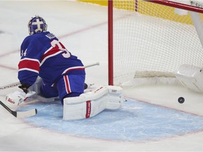 Montreal Canadiens' Jake Allen is beaten by a shot by Edmonton Oilers Jujhar Khaira Feb. 11, 2021.