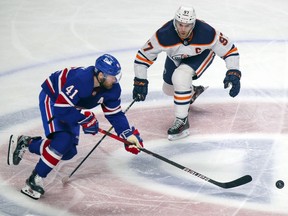 Edmonton Oilers' Connor McDavid tries to slow down Montreal Canadiens' Paul Byron during second period in Montreal on Feb. 11, 2021.