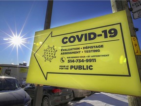 A sign points the way to the COVID-19 testing centre at the Jewish General Hospital in Montreal on Feb. 8, 2021.