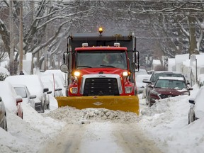 A snowplow clears snow on King-Edward Ave. in the Notre-Dame-de-Grace borough of Montreal Tuesday February 16, 2021.