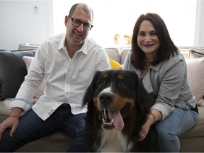 Psychotherapist Lisa Brookman and her husband, child and adolescent psychologist Yaniv Elharrar are pictured at home with Theo, their therapy dog.