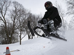 Mario goes through the air as he comes down hill near the George-Etienne Cartier monument on Thursday, February 18, 2021.