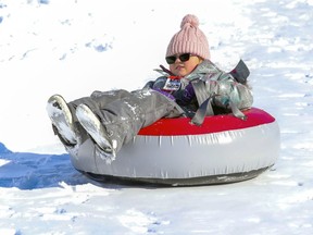 Kylie Maniglio slides down the hill on a tube at Parc Bicentaire in Vaudreuil-Dorion on Feb. 20.