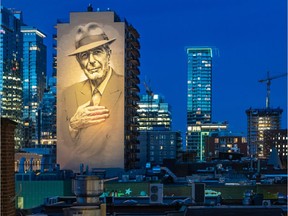The mural on Crescent St. honouring Leonard Cohen is illuminated in June 2019.