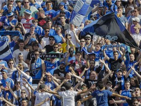 Montreal Impact fans cheer during the first half of the MLS soccer match between the Montreal Impact and the New York City FC at Saputo Stadium in Montreal on July 17, 2016.