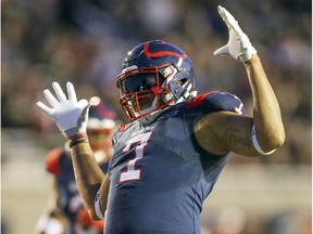 Montreal Alouettes rush-end John Bowman celebrates after sacking Calgary Stampeders quarterback Bo Levi Mitchell during fourth quarter in Montreal on Oct. 5, 2019.