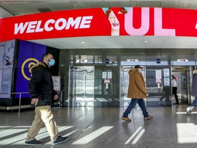 Travellers walk through Montreal's Trudeau airport in December. The existing facility near the airport is different than those in the works for the mandatory three-day quarantine set to come into effect on Monday. It’s been in place since the start of the pandemic as a last resort, and it’s managed by the Public Health Agency of Canada, not the hotel itself.