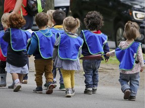 Daycare children walk down a street in the Plateau-Mont-Royal on September 2, 2020.