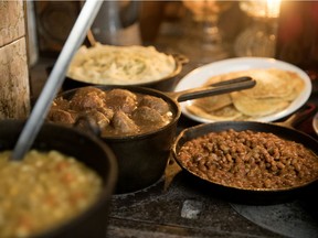 Classic Sugar Shack food warms on an antique oven at Sucrerie La Montagne in Rigaud near Montreal, on Thursday, March 14, 2019. Pea soup, meatballs, mashed potatoes, beans and pancakes.