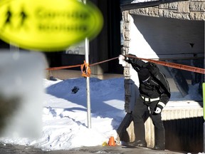 Montreal police investigate the scene of a shooting that left a teenager dead and another person injured Feb. 8, 2021.