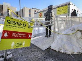 People line up at the COVID-19 testing centre at the Jewish General Hospital in Montreal Feb. 8, 2021.