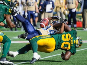 Eskimos' Almondo Sewell knocks the ball loose from Bombers' Paris Cotton during a game in 2014. Sewell, 34, joined the Alouettes as a free agent on Tuesday.