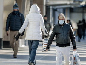 Shoppers in downtown Toronto on February 3, 2021. Health officials are warning Canadians of the potential for increased contagiousness of the COVID variants.