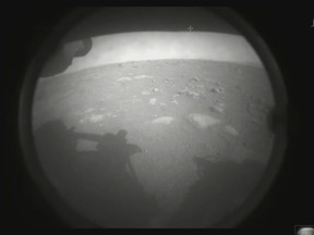 The first image of the Martian surface captured by the Perseverance rover.