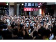 In this file photo, protesters chant slogans and gesture during a rally against a new national security law in Hong Kong on July 1, 2020.