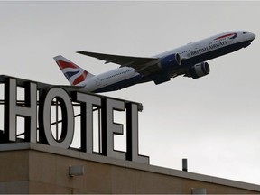 A British Airways aircraft is pictured as it takes off from behind the  Sofitel hotel at Terminal 5 of London Heathrow Airport in west London on February 5, 2021. - Britain confirmed Thursday it will introduce its new mandatory hotel quarantine rules for travellers returning from dozens of countries deemed at "high risk" from Covid-19 variants later this month. The policy, which will begin from February 15, will require all UK citizens and permanent residents returning from countries on its so-called travel ban list to self-isolate in a government approved facility for 10 days.