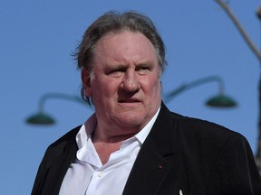 (FILES) In this file photo taken on September 5, 2017, French actor Gerard Depardieu arrives for the screening of the restored version of the movie "Novecento - Atto Primo" by Bernardo Bertolucci, presented as part of Venice Classics selection at the 74th Venice Film Festival at Venice Lido. - French actor Gerard Depardieu has been charged with rape and sexual assault allegedly committed in 2018 against an actress in her 20s, a judicial source told AFP on February 23, 2021. A first probe of the rape accusations against Depardieu, 72, was dropped for lack of evidence but later reopened, leading to criminal charges filed in December, the source said.