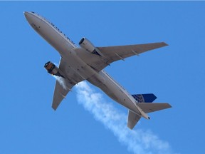 United Airlines flight UA328, carrying 231 passengers and 10 crew on board, returns to Denver International Airport with its starboard engine on fire after it called a Mayday alert, over Denver on Saturday, Feb. 20, 2021.