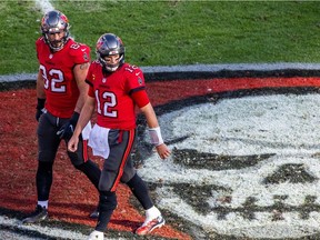Tight-end Antony Auclair and quarterback Tom Brady of the Tampa Bay Buccaneers during game against the Minnesota Vikings at Raymond James Stadium in Tampa on Dec. 13, 2020. The Buccaneers won the game, 26-14.