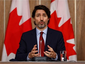 Prime Minister Justin Trudeau takes part in a news conference last week. On Friday, he said he and members of his team are "working around the clock" to procure vaccines.