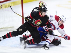 Ottawa Senators defenceman Nikita Zaitsev (22) checks Montreal Canadiens right wing Brendan Gallagher (11) during third period NHL action in Ottawa Feb. 23, 2021.