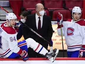 Montreal Canadiens head coach Claude Julien looks toward the ice as his team takes on the Ottawa Senators during second period NHL action in Ottawa on Tuesday, Feb. 23, 2021.