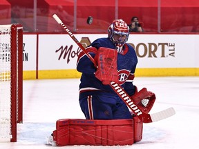 Feb 20, 2021; Montreal, Quebec, CAN; Montreal Canadiens goaltender Carey Price (31) makes a save against Toronto Maple Leafs during the first period at Bell Centre. Mandatory Credit: Jean-Yves Ahern-USA TODAY Sports