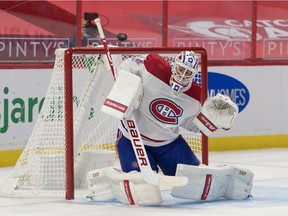 Montreal Canadiens goalie Jake Allen (34) makes a save in the second period against the Ottawa Senators Feb. 21, 2021.