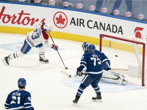 Montreal Canadiens right-winger Tyler Toffoli scores against the Toronto Maple Leafs during the third period at Scotiabank Arena in Toronto on Feb. 13, 2021.