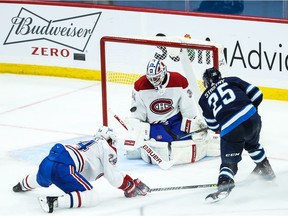 Canadiens goalie Jake Allen saves a shot by Jets forward Paul Stastny during overtime at Bell MTS Place. Moments later, Stastny scored the winning goal.