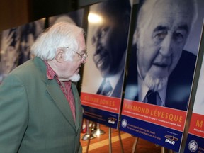Montreal-born singer, composer and playwright Raymond Lévesque walks by his portrait in 2005 at the Governor General's Performing Arts Awards. The ardent separatist refused the award for political reasons.