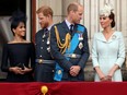 Duchess of Sussex Meghan Markle, Prince Harry, Prince William, Duchess of Cambridge Catherine stand on the balcony of Buckingham Palace while watching a flypast to celebrate the centenary of the Royal Air Force in central London, Britain.
