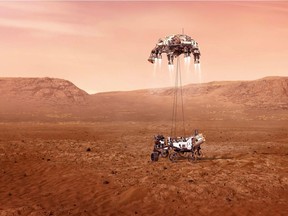 Perseverance rover is shown to be lowered to Martian surface by jet-powered "sky crane" descent vehicle in this undated illustration handout. NASA/JPL-Caltech/Handout via REUTERS    ATTENTION EDITORS - THIS IMAGE HAS BEEN SUPPLIED BY A THIRD PARTY. MANDATORY CREDIT