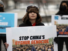Umer Jan, 12, takes part in a rally to encourage Canada and other countries as they consider labeling China's treatment of its Uighur population and Muslim minorities as genocide, outside the Canadian Embassy in Washington, D.C., U.S. February 19, 2021.