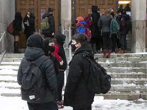 Students arrive at Westmount High School in January for the first day back following the Christmas break. "We know there are outbreaks in schools, but they are controllable,” Quebec public health director Horacio Arruda said Tuesday.