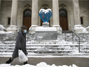 A pedestrian walks past the Montreal Museum of Fine Arts on Feb. 3, 2021. "Spirituality is concentrated human love in its most basic form. Love with intent to heal oneself and others," Lise Ravary writes.