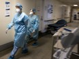 Two nurses do rounds inside the Covid-19 unit of the Verdun Hospital in Montreal, on Tuesday, February 16, 2021.