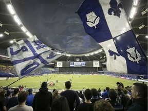 Montreal Impact fans cheer on during the opening minutes of the first half of the CONCACAF Champions League match against the Deportivo Saprissa, in Montreal on Wednesday February 26, 2020.