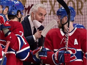 Canadiens interim head coach Dominique Ducharme speaks with forward Paul Byron on the bench during Tuesday night’s game at the Bell Centre against the Ottawa Senators.
