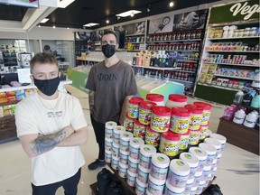 Jeffrey Whaley, left, and Kevin Fabregue, BMX performers for Cirque du Soleil, at their Shop Santé store in Pointe-Claire.