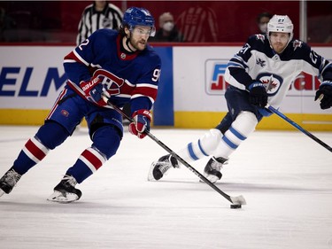Winnipeg Jets left wing Nikolaj Ehlers chases Montreal Canadiens left wing Jonathan Drouin in the first period at the Bell Centre on Thursday, March 4, 2021.