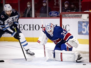 Winnipeg Jets right wing Blake Wheeler watches as Montreal Canadiens goaltender Jake Allen makes a save in the third period in Montreal on Thursday, March 4, 2021.